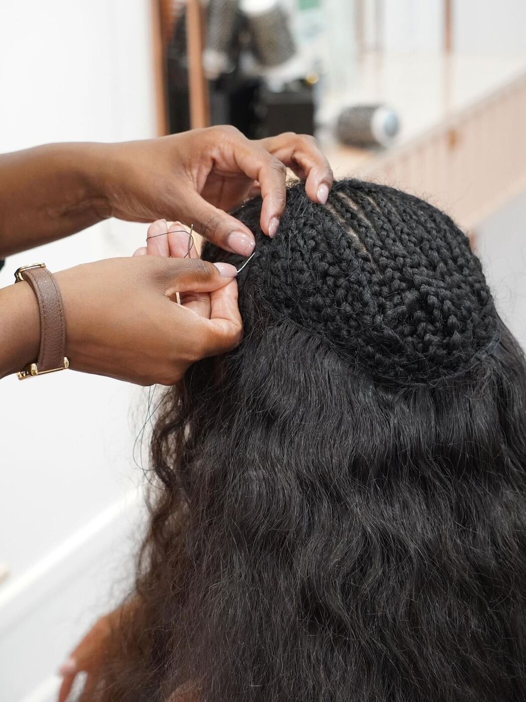 Sew-in with Closure hair extensions at Adore
